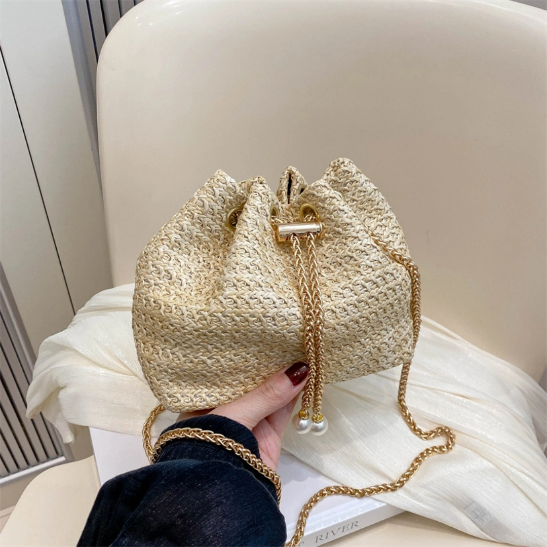 Ladies Mini Straw Woven Bucket Crossbody Bag Pearl Drawstring Shoulder Purse Gold Chain Beach Vacation Bag view 2
