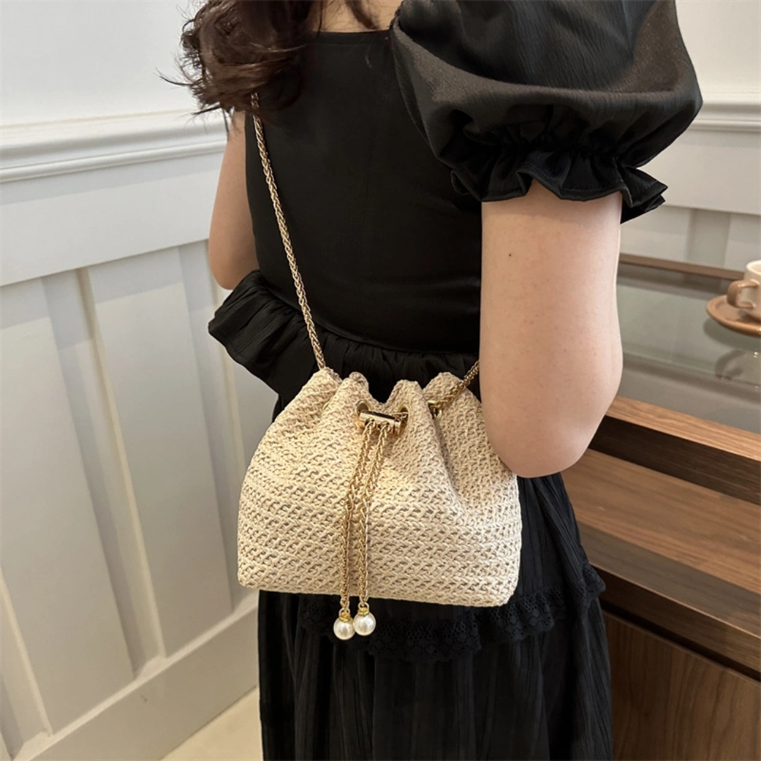 Ladies Mini Straw Woven Bucket Crossbody Bag Pearl Drawstring Shoulder Purse Gold Chain Beach Vacation Bag view 3